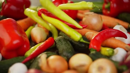 Slow Motion Video of Green and Red Chilies Roasting Vegetables