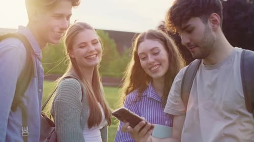 Group of caucasian students taking selfie outside the university campus. Shot with RED helium camera