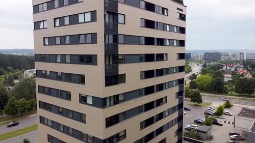 Fly away form high tall rise building opening city scape