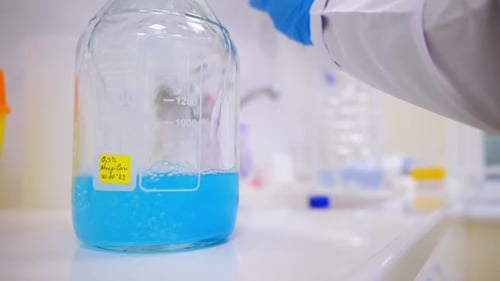 Blue Liquid in Glass Jar in a Lab