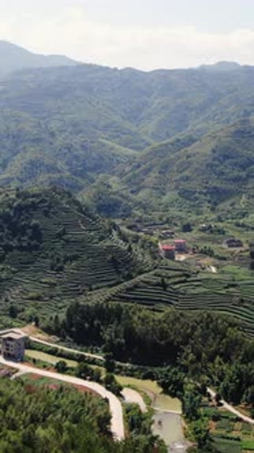 An Aerial View of Amazing Lush Green Mountains Surrounded By a Picturesque Rural Landscape Media