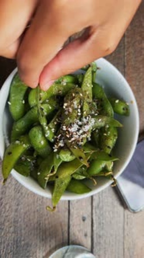 Top View of Having Edamame on the Café's Terrace During the Summer Season