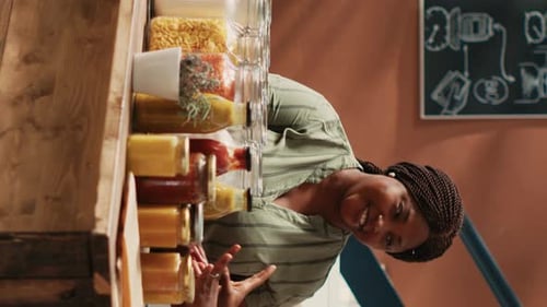 Vertical Video Vendor Presenting Additives Free Bulk Items for Client in Store