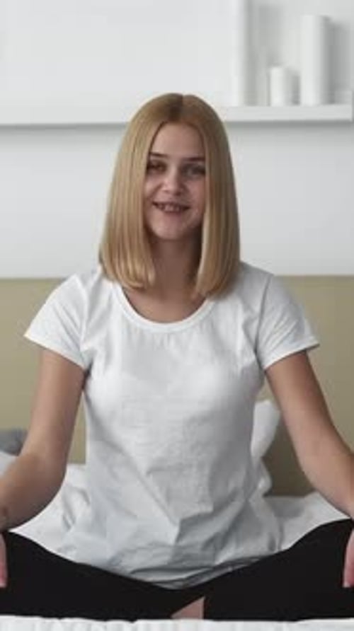 Young Woman Talking Directly to Camera