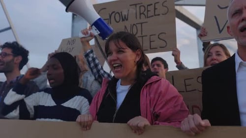 Diverse Group Protests Social Injustice with Megaphone