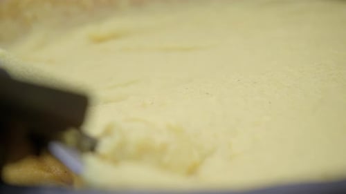 Shot Of Attractive Cornmeal Mush Preparing Italian Polenta