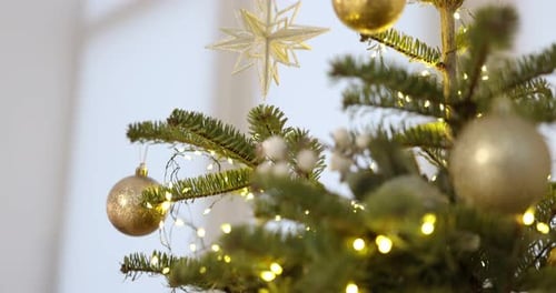 Festive Christmas Tree Ornaments and Twinkling Fairy Lights