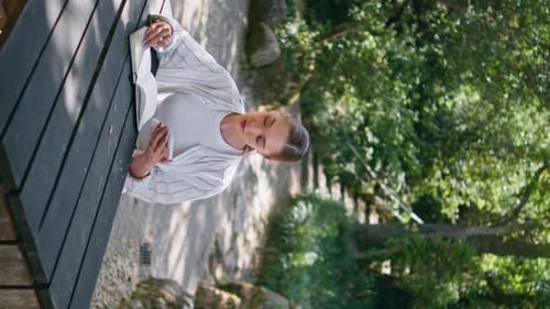 Girl Copybook Using Smartphone Surfing Information Online Sitting Park Vertical