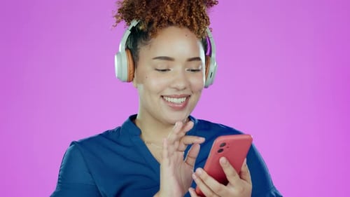 Phone, music and black woman with headphone dance in studio for relax, chilling