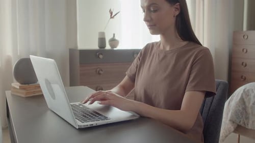 Woman Sitting in Her Studio, Remotely Working