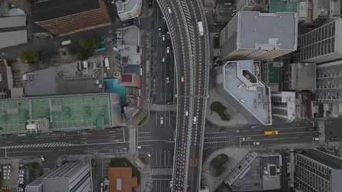 Fly Above Transport Infrastructure in City Birds Eye Shot of Vehicles Driving on Elevated
