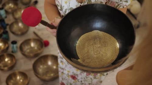 Woman Holding Metal Singing Bowl for Meditation