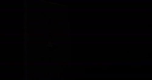 Hand Turns Light Switch On and Off