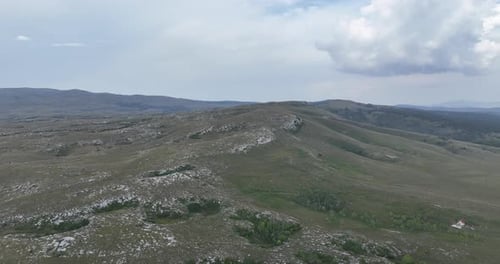 Aerial View of Rolling Green Hills Landscape