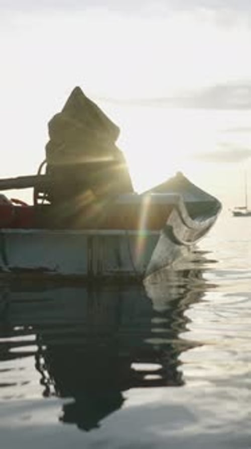 Boat Anchored in the Sea with a Beautiful Sunset on Koh Tao