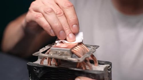 Cleaning Dusty Computer Cooling Fan with Cloth