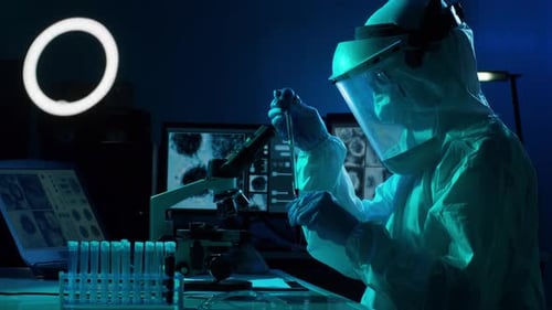 Scientist Working in a Lab with Protective Suit