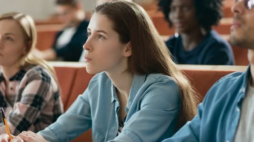 Students Listen Intently in University Lecture Hall