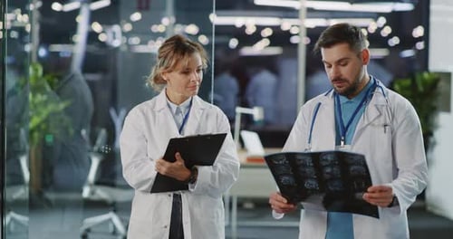 Doctors review MRI scan in a hospital setting