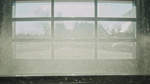 Nozzle starting to spray car inside automated car wash tunnel