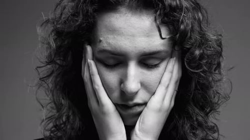 Pensive Woman with Sad Expression, Close-up of Thoughtful Melancholic Face in monochromatic,