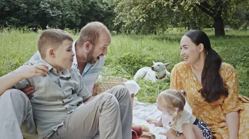 Family Picnic with Toddler and Dog in the Park