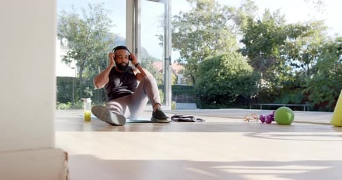 Man Taking a Break From Home Workout