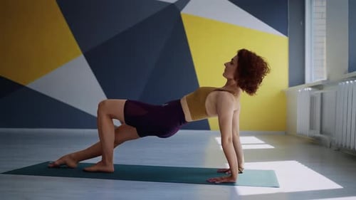 Flexible Athletic Woman Training In Fitness Studio Lady Practicing Yoga Asana In Fitness Center