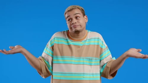 Difficult Question Guilty Reaction Puzzled Stylish Guy on Blue Background
