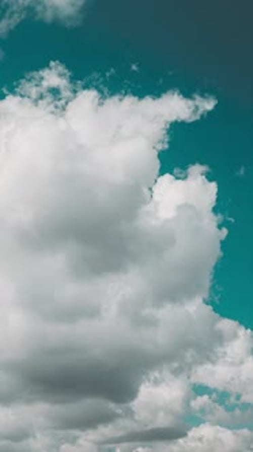 Drifting White Clouds Against the Azure Sky