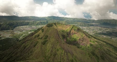 Cloudy day over Mount Batur crater on Bali island, Indonesia. Aerial view