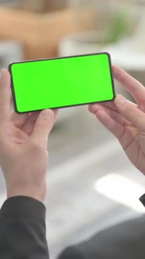 Businessman Watching Smartphone with Green Screen, vertical video