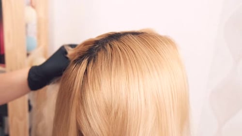 Applying Dye to Roots of Blonde Hair