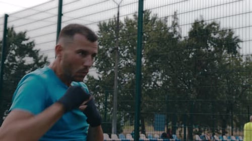 Man Shadow Boxing Outdoors for Fitness Training