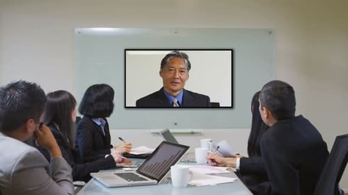Business Team in Meeting with Video Conference