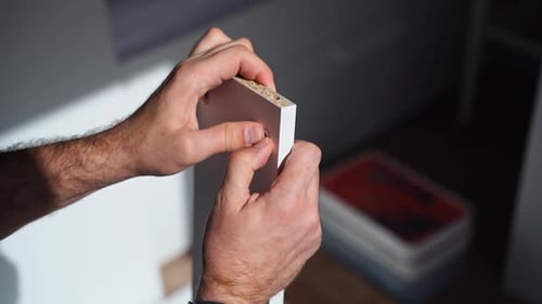 Caucasian Man Assembles Furniture Fit Table or Mount Wardrobe