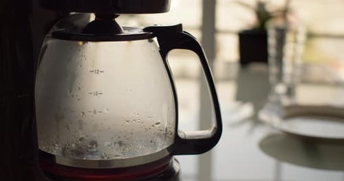 Preparing Delicious Invigorating Filter Coffee in the Kitchen at Home