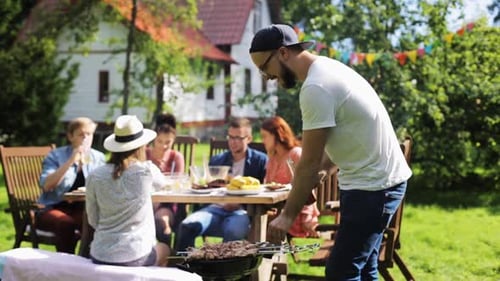 Friends Gather for Backyard Barbecue on Sunny Day