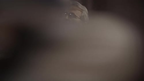 Man in Suit Thinking in a Crowd