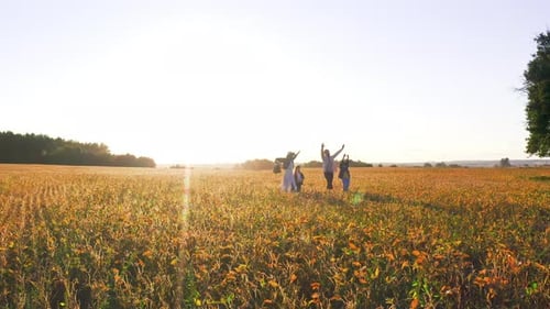 Countryside Happy Family Lovely Two Kids with Their Parents Walking on Field Enjoying Bright Sunny