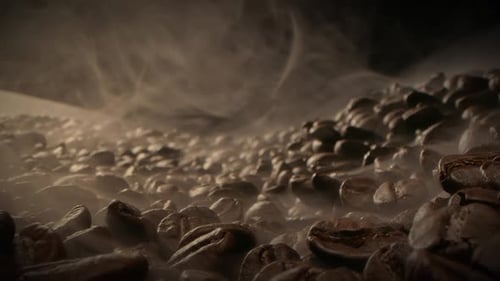 Macro Shot Roasting Coffee Beans Filmed in a Dark Key the Smoke Emanating From the Roasting of