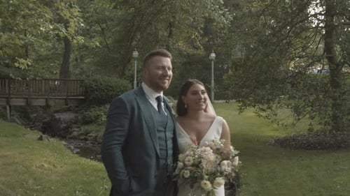 Smiling bride and groom in formalwear. The wedding is finally here and the ceremony can proceed aft