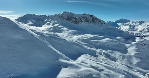 Aerial View of Snowy Mountain Range in Winter