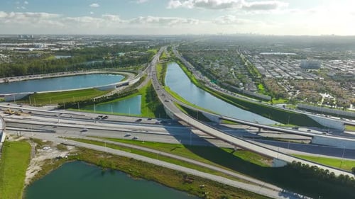 Aerial View of American Freeway Intersection with Slow Driving Cars During Rush Hour in Miami