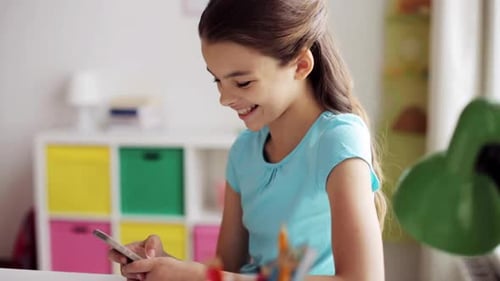Happy Girl Using Smartphone in Brightly Lit Room