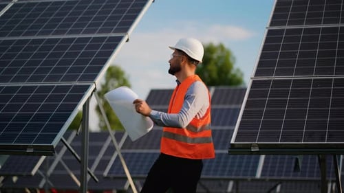 Solar Energy Engineer Inspecting Photovoltaic Panel Installation