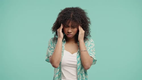 African Teen Girl Suffering Migraine Headache Blue Studio Hands On Head