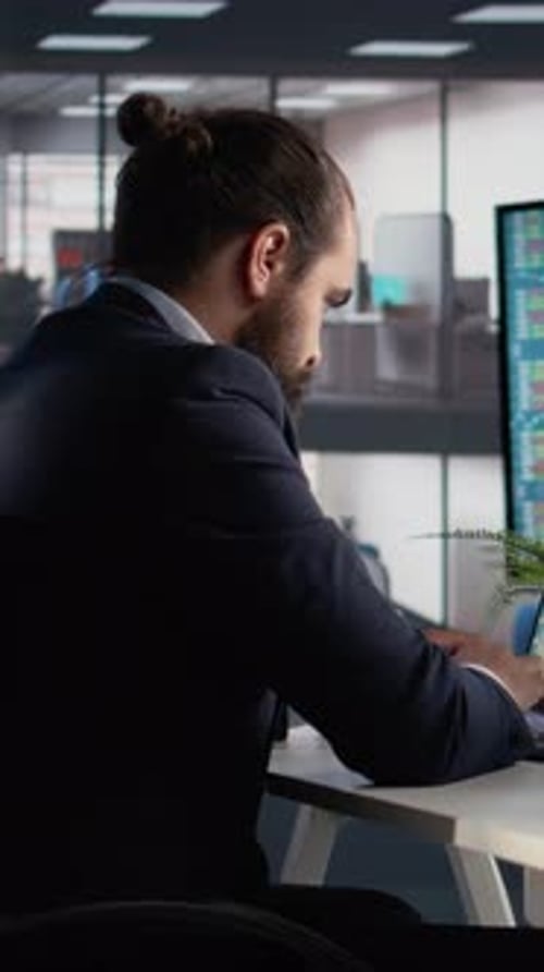 Vertical Video Business Leader Engaged in Data Analysis Laptop and Tablet Devices
