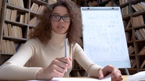 Young Woman Latin School Math Teacher Looking at Webcam Giving Remote Class