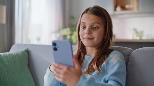 Girl Using Smartphone for Video Call at Home